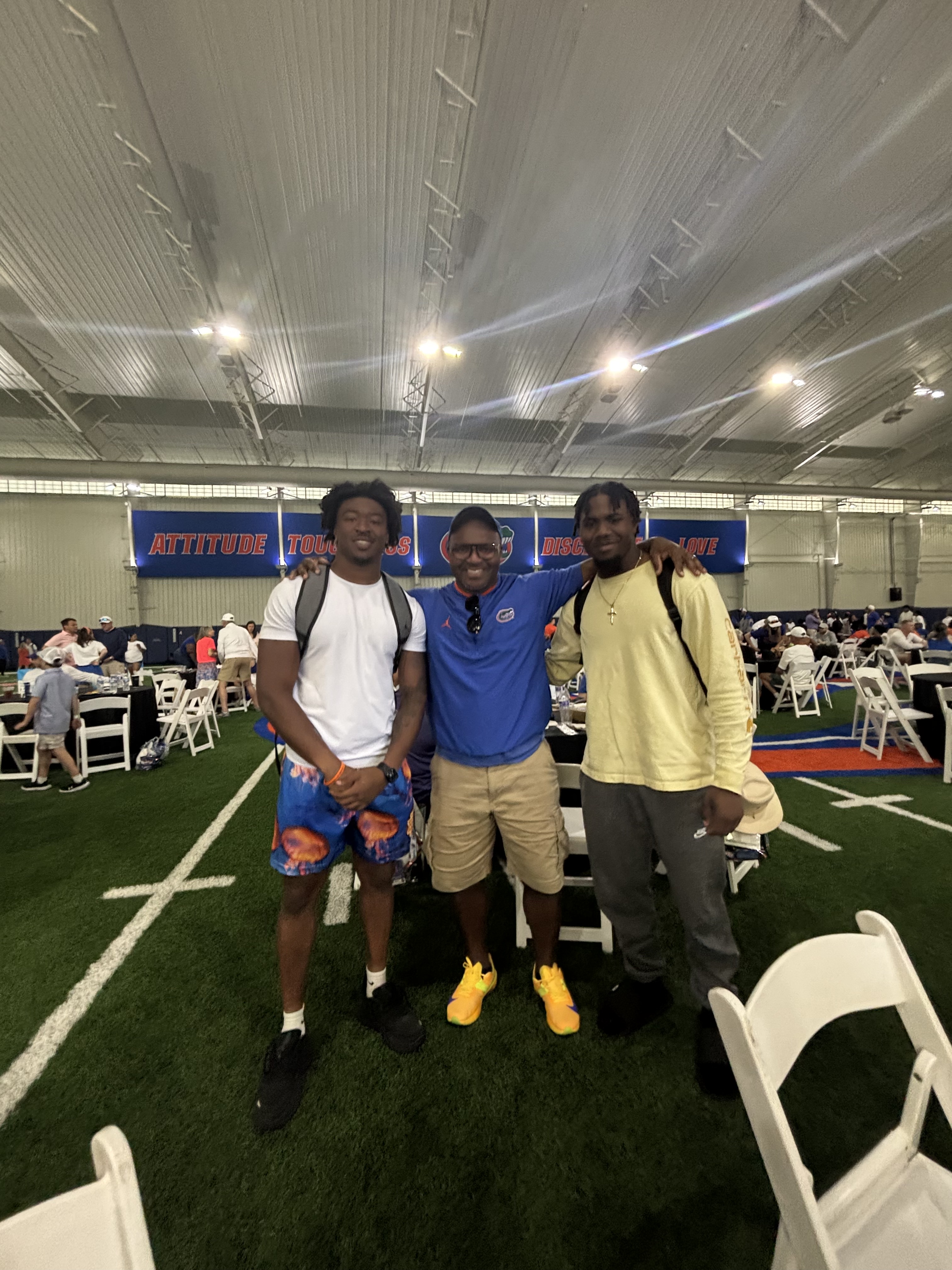 Sports facility gathering on turf field